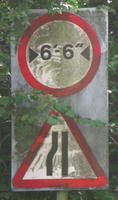 [Road narrows on left] [6′-6″ width limit]